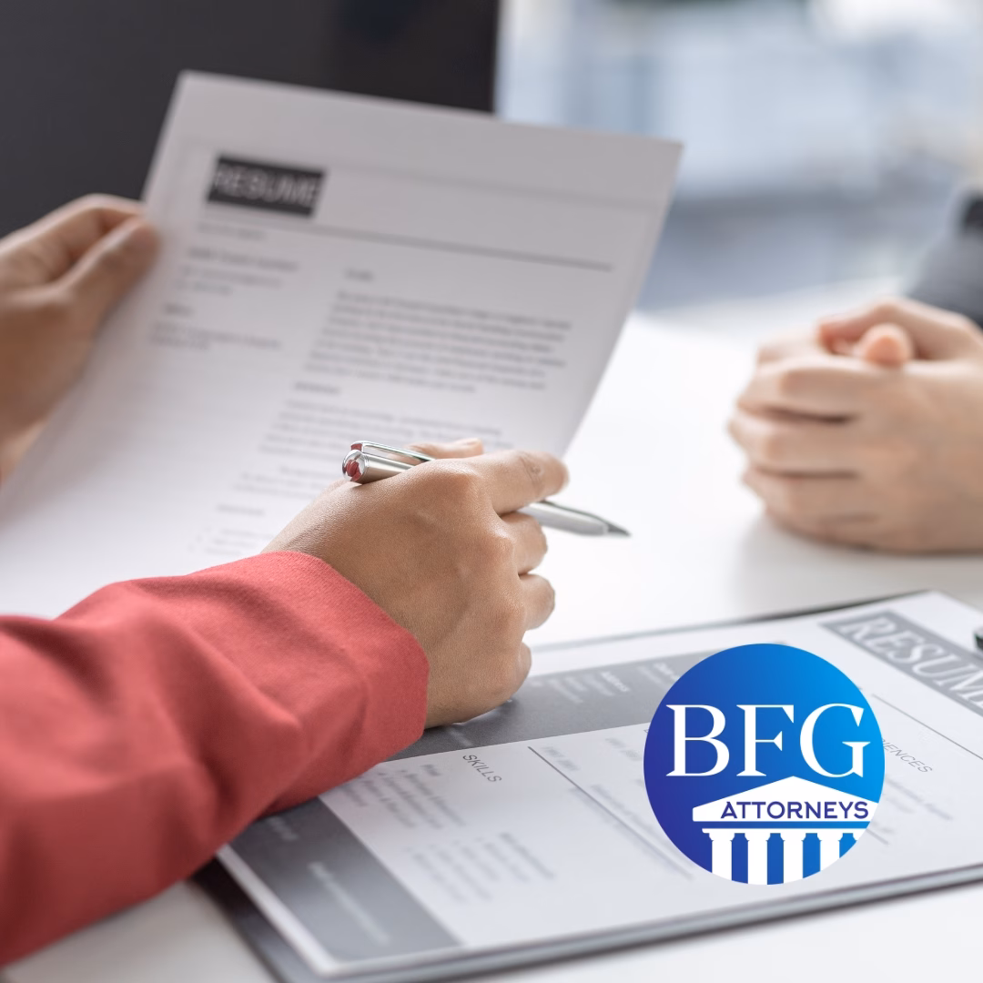 A potential employee going over and employment contract with a company representative