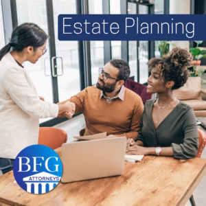 A couple meeting with an estate planning attorney. With the Bangerter Frazier Group logo and a banner that says estate planning.