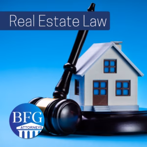 A house with a gavel leaning on it. With the Bangerter Frazier Group-Attorneys logo and a banner that says Real Estate Law.